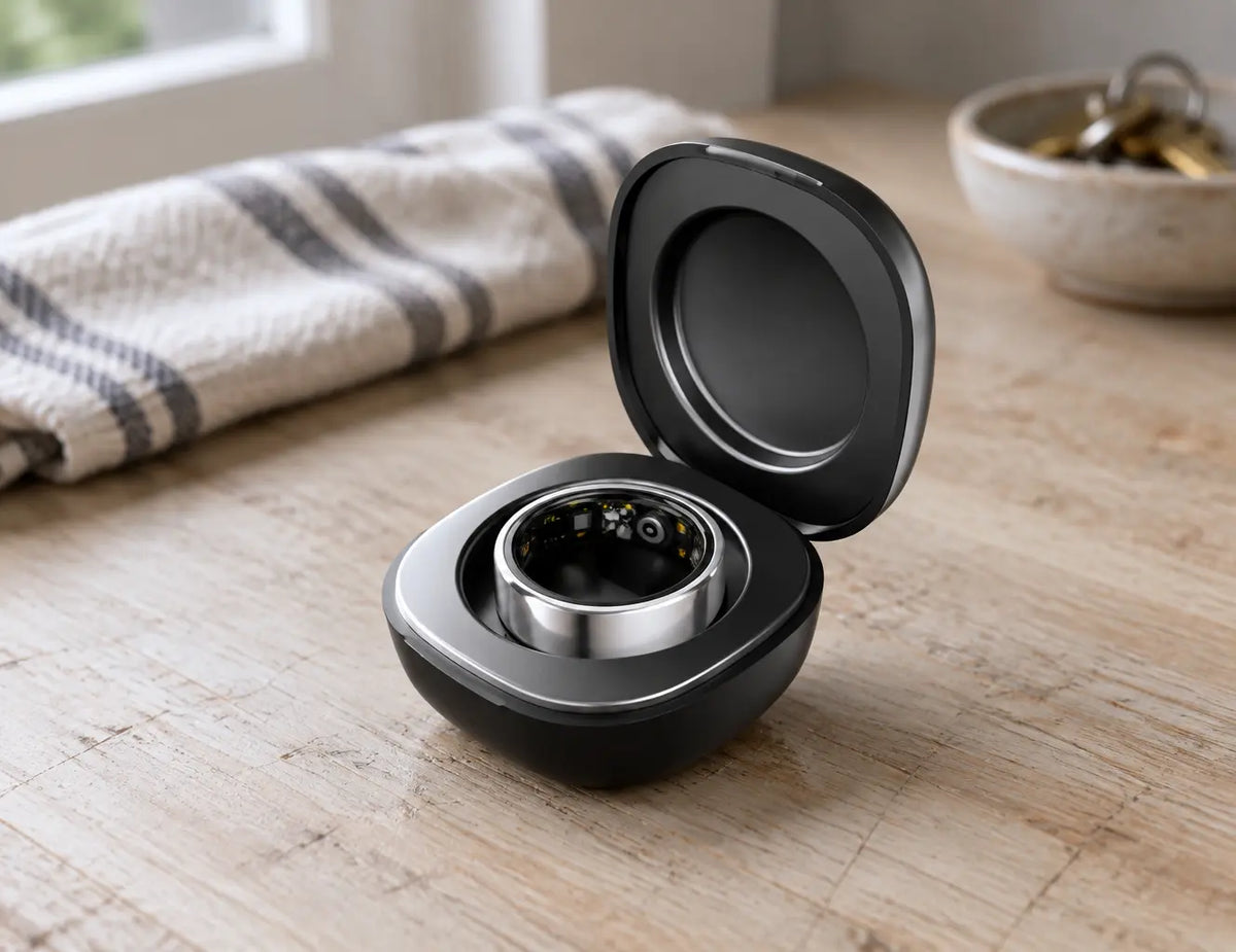 A close product photograph of the compact charging case shown in the reference, open on a scratched