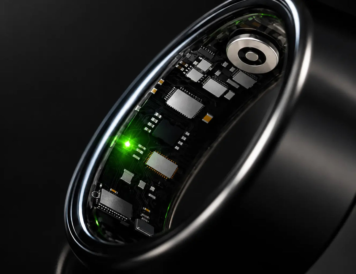 An extreme macro product photograph of the inner curve of Smart Ringl, showing the dark sensor-lined